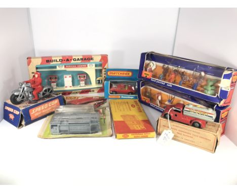 A Dinky Action kit #1017, a Matchbox super king car, a Dinky road hoarding #765, a Build-a- garage, a speed cop, 2 hand paint