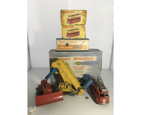 A collection of dinky comprising two dinky buses 290 , boxed lawn mower boxed elevator loader Fire engine and bulldozer .