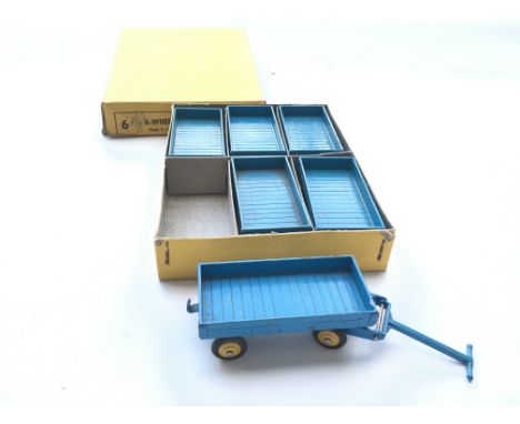 A Dinky toys 4-Wheel Hand truck trade box #105c. Contains all 6.