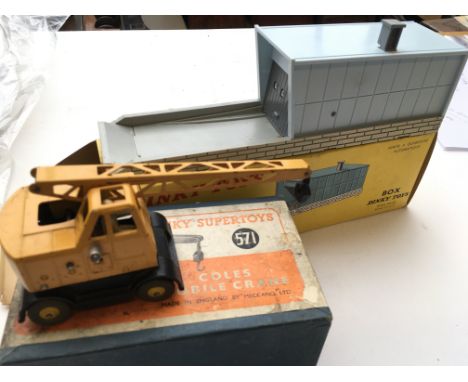 A Dinky Supertoys Coles Mobile Crane (damaged) boxed #571 and a French automatic Garage boxed #502.