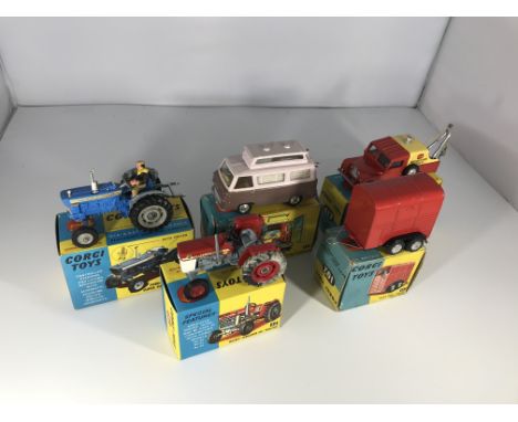 A collection of Corgi Toys vehicles. A Ford 5000 Super Major tractor #67, a Massey-Ferguson 165 tractor #66 (heavy wheel dama