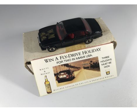 A "Whyte &amp; Mackay" promotional Matchbox Jaguar XJ6.