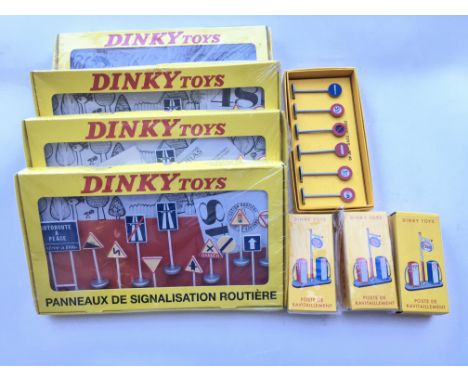 A Collection of Atlas Dinky Road signs and petrol pumps.