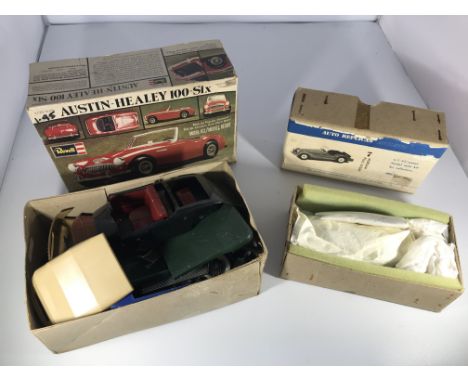 Two model car building kits. A Revell Austin-Healey 100-Six &amp; an Auto Replicas England Morgan Plus Eight.