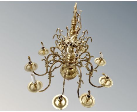 A decorative continental brass eight way chandelier 