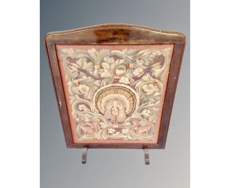 An early 20th century tapestry fire screen 