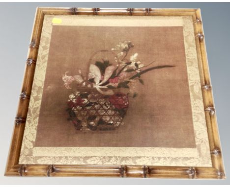 A Japanese style print depicting a basket of flowers in faux bamboo frame 