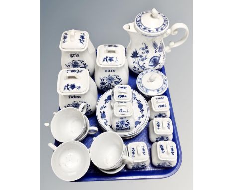 A continental blue and white floral patterned tea service with matching storage jars 