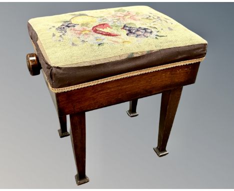 A late Victorian mahogany rise and fall piano stool, with tapestry seat, provenance : From the Estate of Dame Catherine Cooks