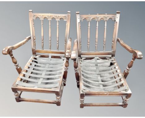 A pair of Ercol low armchairs in antique finish (no cushions) 