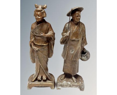 A pair of Chinese pot metal figures. (height 31cm)