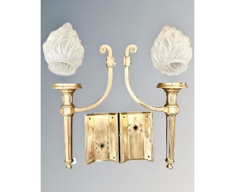A pair of Art Deco brass wall lights, cast in heavy gauge brass with frosted glass 'flame' lamp shades, approximately height 