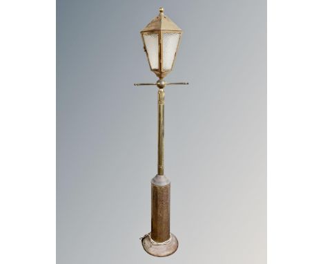 A brass floor lamp in the form of a Victorian street light 