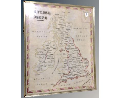 An antique tapestry of the British Isles and Ireland in frame 