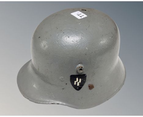 A WWII style German helmet.