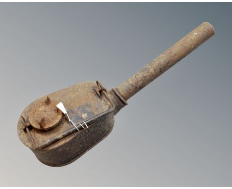 An antique C Wells and company cast iron paraffin torch lamp 
