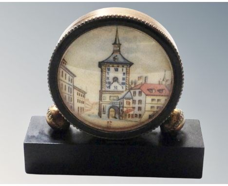 A vintage miniature brass cased desk clock with Swiss movement on marble stand 