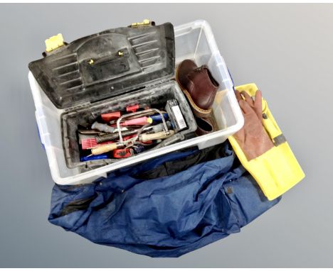 A plastic crate containing tool box and tools, waterproof coat, trousers, pair of Clarks boots size 9