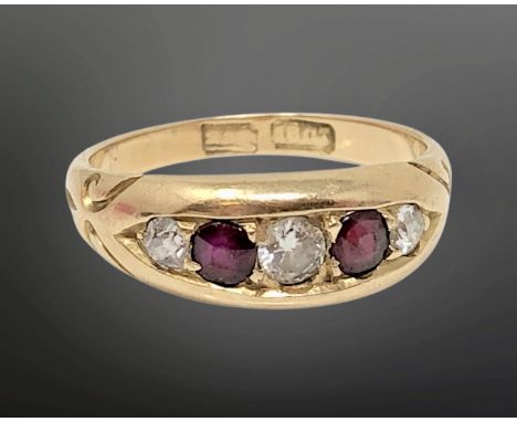 An antique 18ct gold ruby and diamond ring, size M CONDITION REPORT: 4.5g The central diamond approximately 3 mm in diameter.