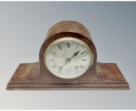 A 1930s eight-day mantel clock with silvered dial.