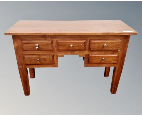 A hardwood five drawer console table 