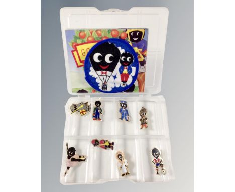 A set of eight Golly pin badges produced for Robertsons together with a sew on patch 