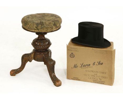 A Victorian overstuffed upholstered music stool, on a carved tripod base, together with a top hat, by McLaven & Son, 20.5cm x