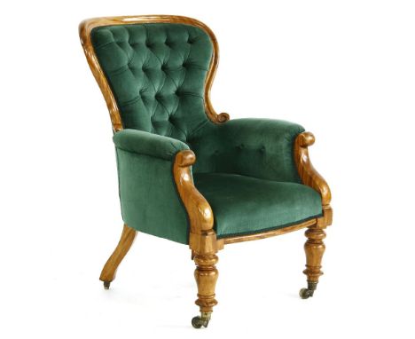 A Victorian button upholstered armchair, on turned supports, 69 x 75 x 101cm