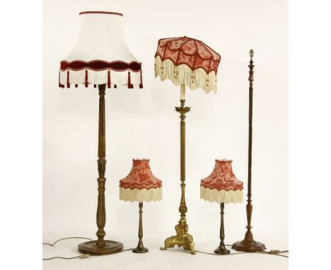 Two standard lamps, with a tasselled shade, another standard lamp, and a pair of matching table lamps (3)