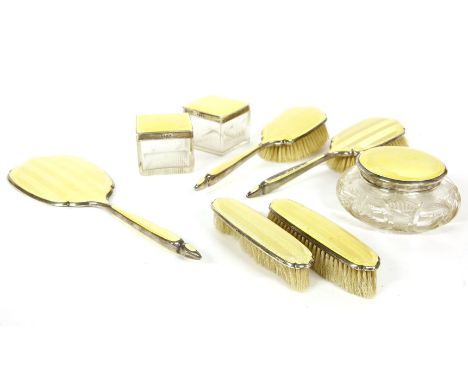 A silver and enamel dressing table set