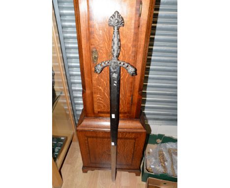 A large decorative broad sword by Ancient Warrior. 95cm blade with etched panels to both sides featuring heraldic designs of 