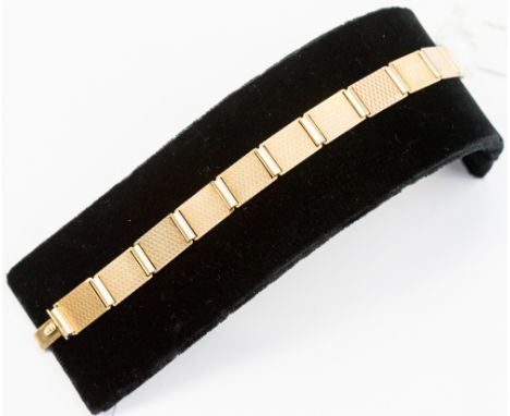 A 9ct gold 1930s engine turned decoration to flat links bracelet, 12.2 grams approx 