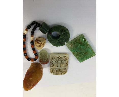 A collection of generally 20th century, carved jade artefact's including Buddhist prayer beads and toggle etc (6)