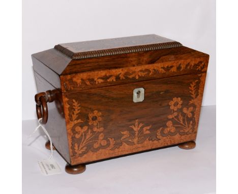 A Victorian rosewood and marquetry inlaid tea caddy, sarcophagus form with ring handles 