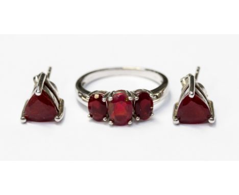 A cherry red opal triplet, three stone ring, silver set, size N, with a pair of matching earrings, triangular cut, silver set