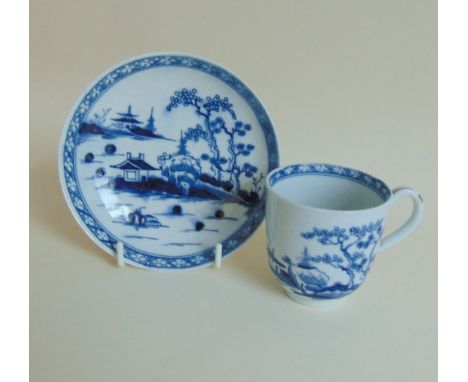A Worcester blue and white coffee cup and saucer, 'Canon Ball' pattern. Circa 1765-70, Size, cup 6.5cms high x 6cm diameter,S