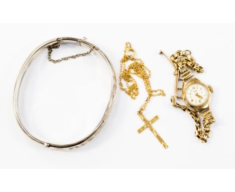 A 9ct gold crucifix and chain, approx 2.1 grams, a 9ct gold cased ladies wristwatch on 9ct gold strap, approx 11.9 grams and 