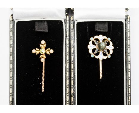 Two gem set stick pins, one set in yellow metal, set with a star stone with white, blue and black enamel surround, af stone c