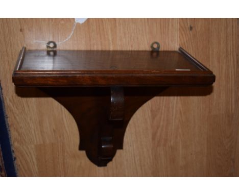 Mahogany wall bracket with scroll design support
