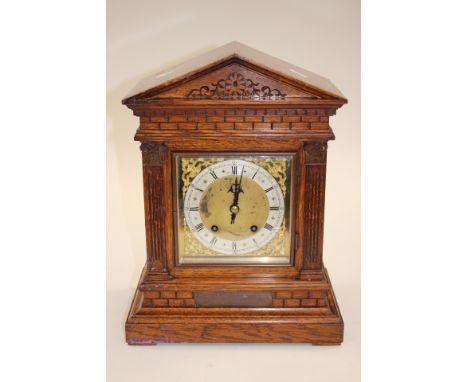 An Oak mantle clock with pendulum (no key) inscription for winner of Horticultural prize in Brighton 1876