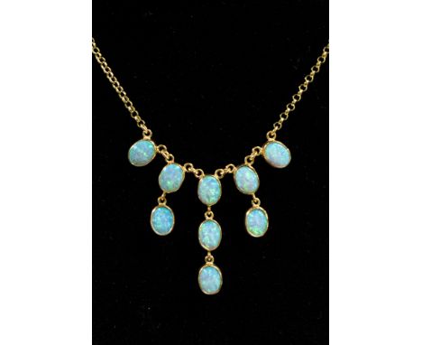 A synthetic opal necklace, set with nine oval  synthetic opals in a fringe design, in 9ct gold, approx length 18'' and a tota