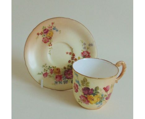 A Royal Worcester coffee cup and saucer, blush ground with floral sprays, circa 1909, sizes approx, saucer 11cms diameter, cu
