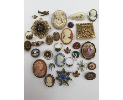 A collection of badges, brooches, rings, etc, to include cameos and enamel badges (31) 