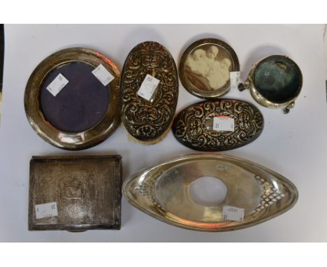 Eight items of silver, two silver backed hairbrushes, two frames, a cigarette case, thimble, tray and a pot (8) 