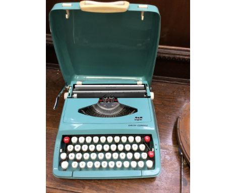A Tom Tom drum (skin and wood) a pair of skis and a portable Smith-Corona 1960s typewriter in case, parcel lot (3) 