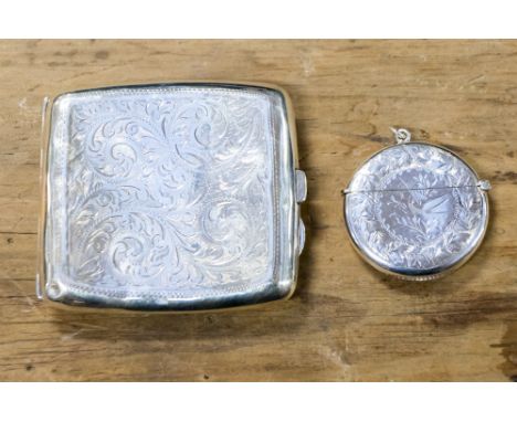 A George V silver cigarette case, the body engraved with foliate scroll decoration, W H Tandy & Sons, Chester, 1923 together 