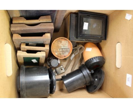 A box of 1920/30s dark room equipment to include light shade frames, clips, etc 
