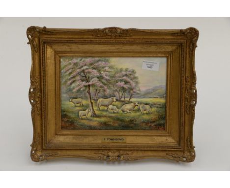 A Royal Worcester framed plaque, signed E. Townsend, Sheep in field under trees of blossom 