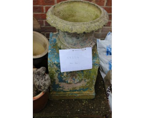 A 20th Century urn on plinth hollow 