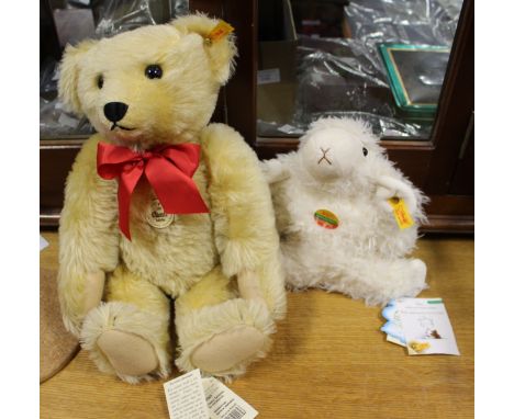 A Steiff 1909 Classic Teddy Bear, 000393, together with a Steiff Lamb, 082474, both within plastic cases (2)